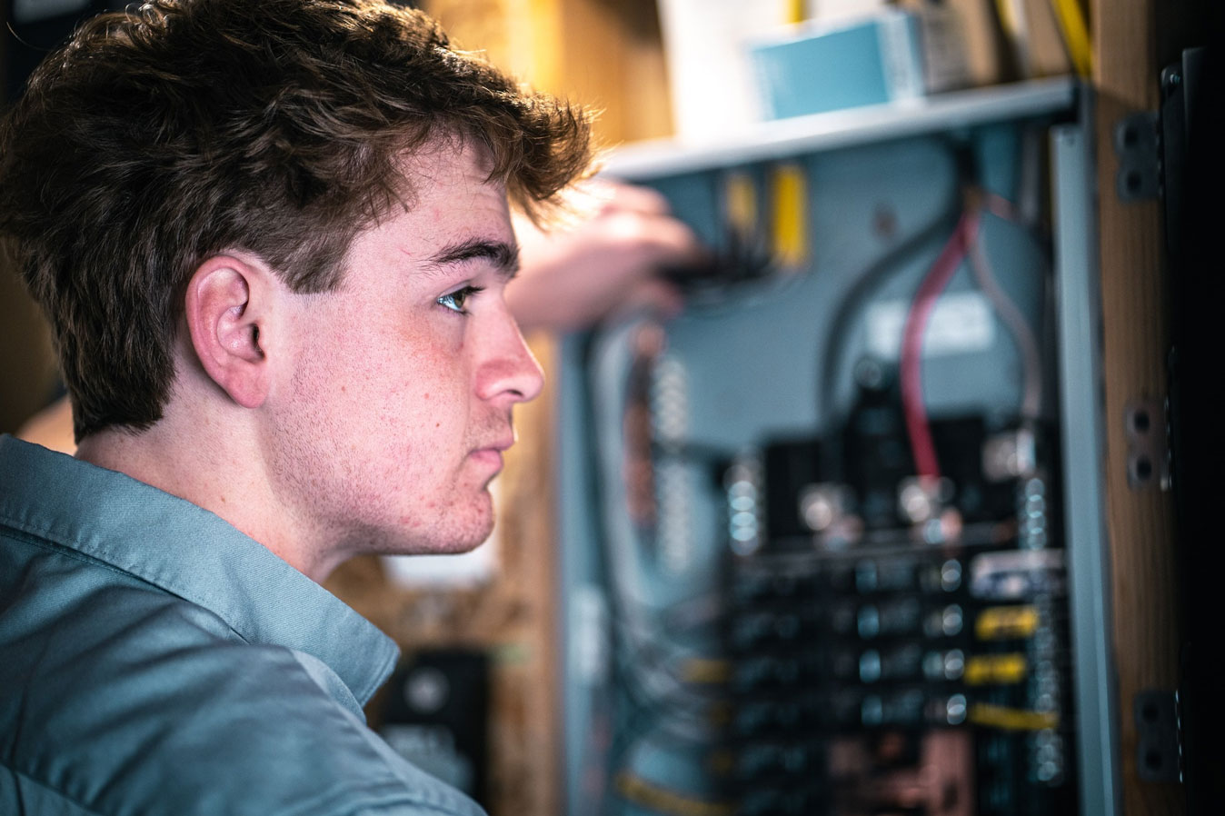 Electrician working on electric panel