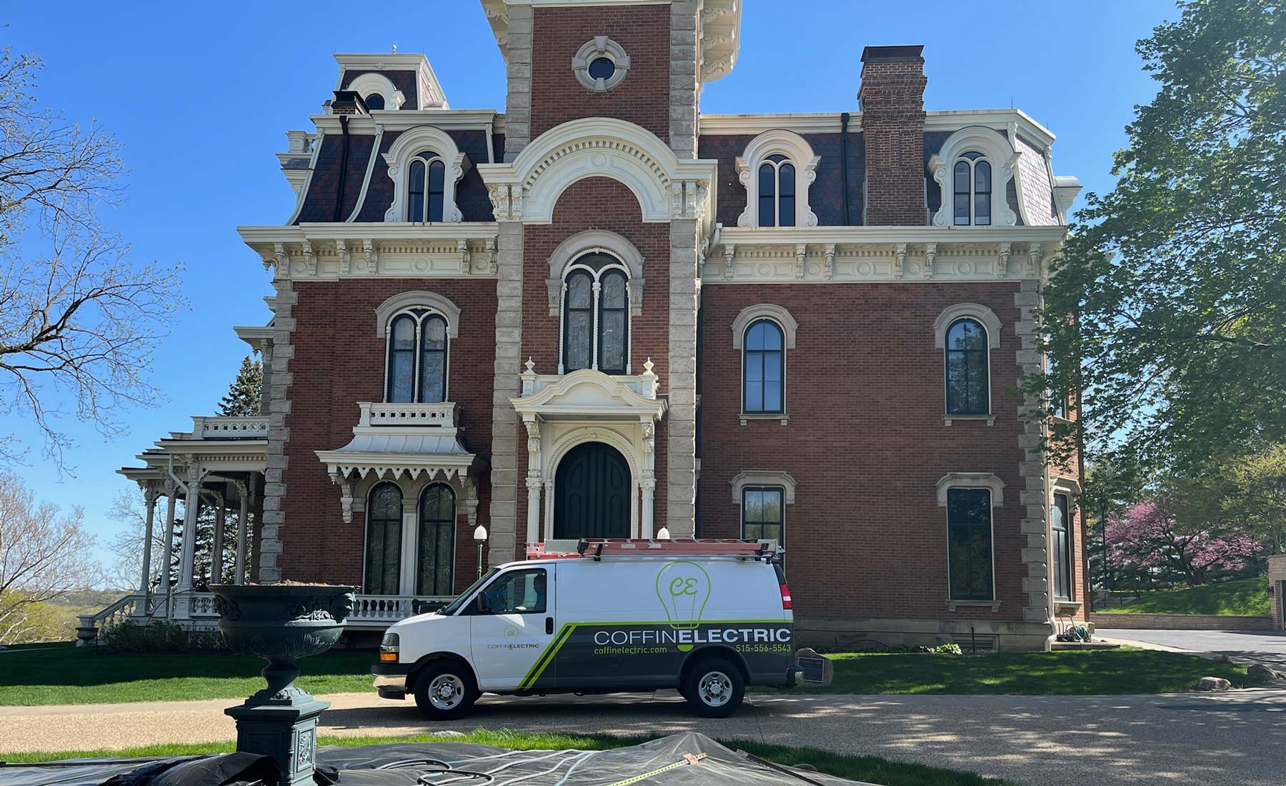 Coffin electric van outside house